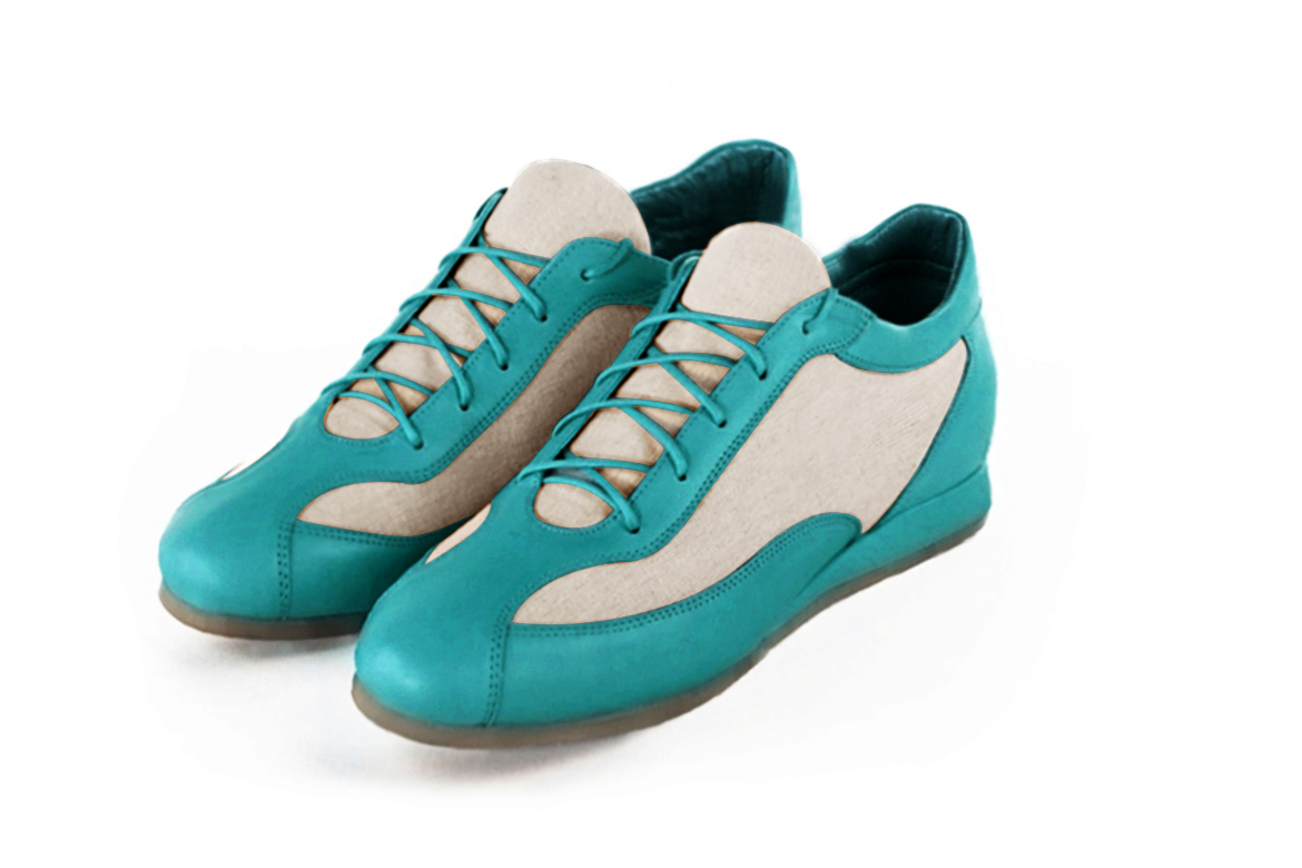Basket femme habillée : Sneaker urbain bicolore couleur bleu turquoise et beige naturel. Semelle fine. Doublure cuir Vue avant - Florence KOOIJMAN