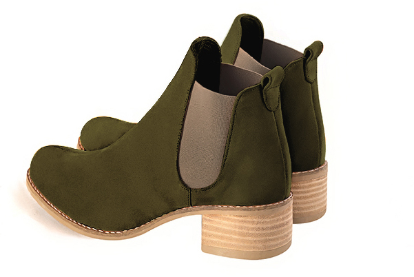 Boots femme : Boots élastiques sur les côtés couleur vert kaki et beige mastic. Bout rond. Semelle cuir petit talon. Vue arrière - Florence KOOIJMAN