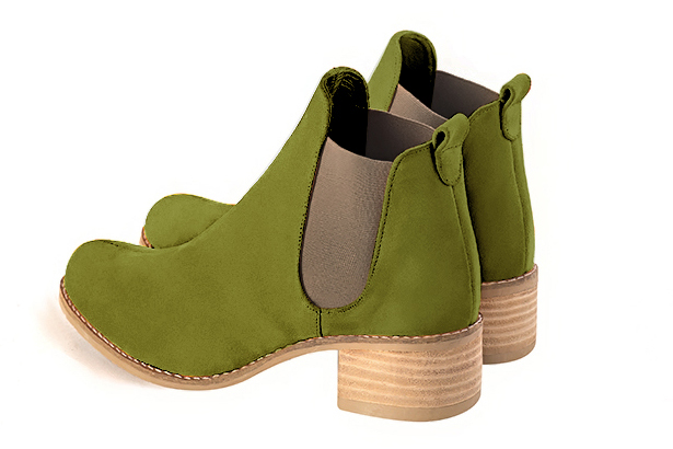 Boots femme : Boots élastiques sur les côtés couleur vert pistache et beige mastic. Bout rond. Semelle cuir petit talon. Vue arrière - Florence KOOIJMAN