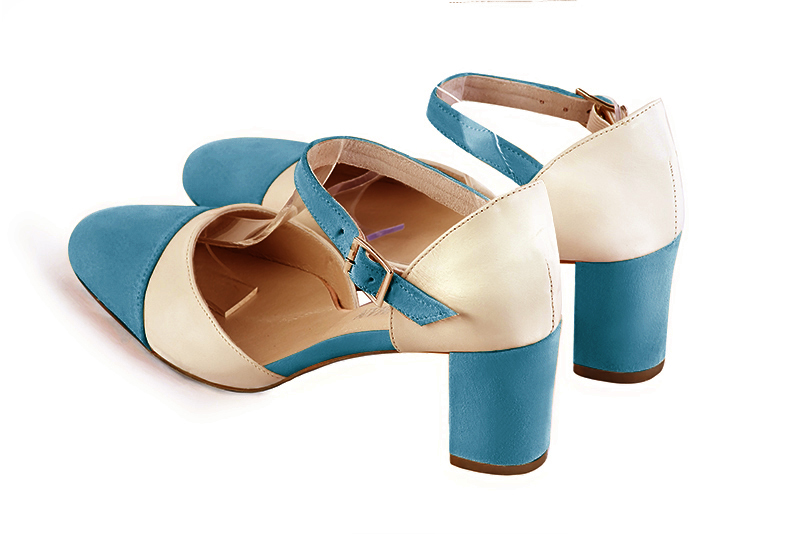 Chaussure femme à brides : Chaussure côtés ouverts bride cou-de-pied couleur bleu canard et blanc ivoire. Bout rond. Talon mi-haut bottier. Vue arrière - Florence KOOIJMAN