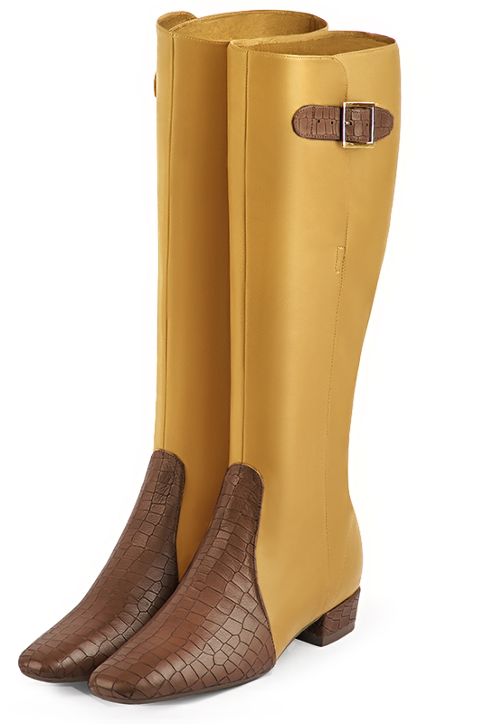 Bottes femme élégantes et raffinées, avec des boucles, réalisées sur mesure, coloris marron caramel et jaune ocre. Bout carré. Mi-haut. Talon bottier. Mollets fins ou larges. Personnalisation : Choix des cuirs, des couleurs et des talons. - Florence KOOIJMAN