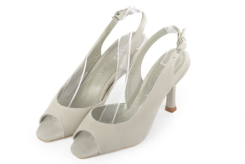 Sandale femme : Sandale soirées et cérémonies couleur blanc cassé. Bout carré. Talon haut fin Vue avant - Florence KOOIJMAN