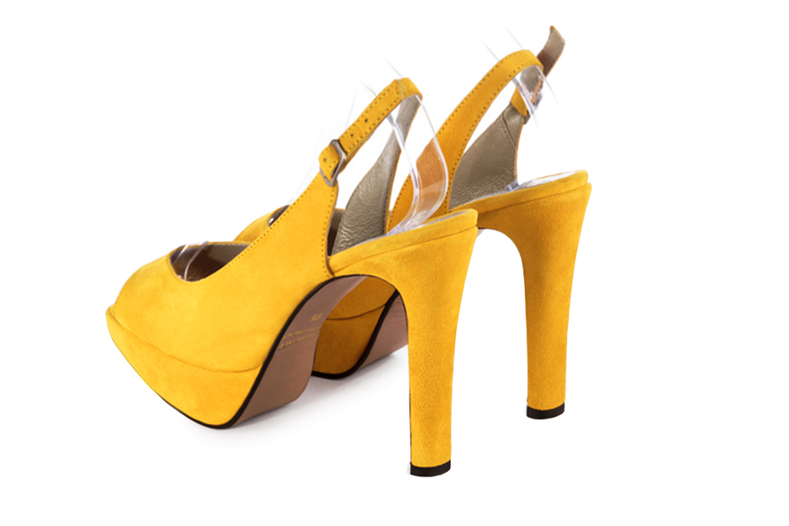 Sandale femme : Sandale soirées et cérémonies couleur jaune soleil. Bout rond. Talon très haut fin. Plateforme à l'avant. Vue arrière - Florence KOOIJMAN