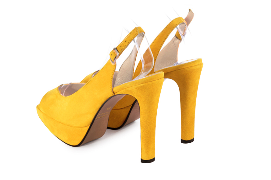 Escarpins habillés bout ouvert bride arrière cuir jaune à talon fin de 12.5 cm avec une plateforme de 2.5 cm à l'avant et bout rond - Vue arrière