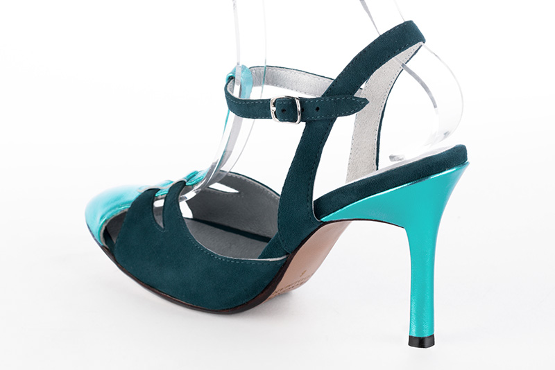 Chaussure femme à brides : Salomé ouverte à l'arrière couleur bleu lagon. Bout rond. Talon très haut fin. Vue arrière - Florence KOOIJMAN