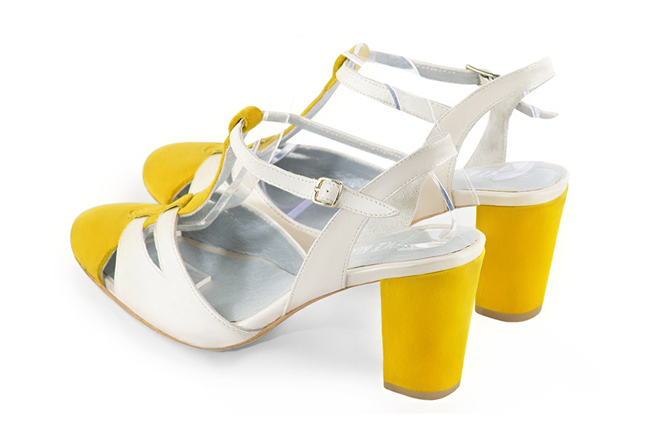 Chaussure femme à brides : Salomé ouverte à l'arrière couleur jaune soleil et blanc cassé. Bout rond. Talon haut bottier. Vue arrière - Florence KOOIJMAN