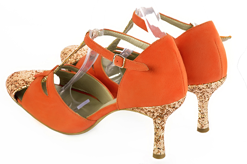 Chaussure femme côtés ouverts : Chaussure femme salomé ouverte sur les côtés couleur or cuivré et orange clémentine. Talon haut. Talon fin. Bout rond - Florence KOOIJMAN