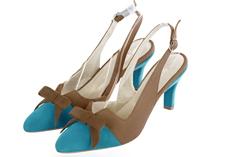 Escarpins habillés, élégants et raffinés, ouverts à l'arrière avec un noeud sur l'avant, coloris bleu turquoise et marron chocolat. Bout effilé. Mi-haut à haut. Talon fin. Cérémonie, soirée, cocktail, évènementiel. Personnalisation : Choix des cuirs, 
                des couleurs et des talons. Petites et grandes pointures. - Florence KOOIJMAN