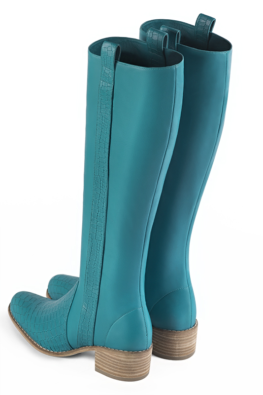 Bottes femme cavalières élégantes et raffinées, réalisées sur mesure, coloris bleu turquoise. Bout rond. Semelle cuir mi-haut. Mollets fins ou larges. Personnalisation : Choix des cuirs, des couleurs et des talons. - Florence KOOIJMAN