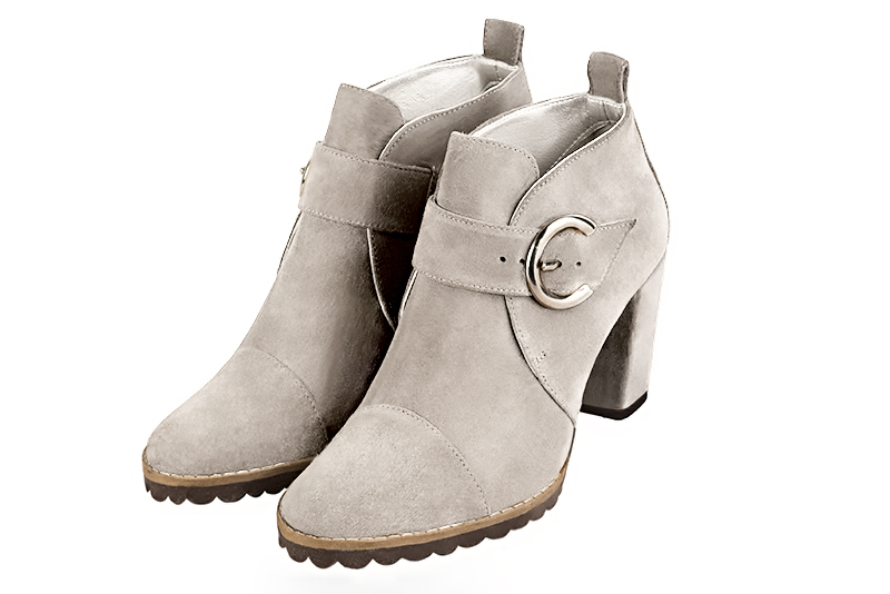 Bottines élégantes et raffinées avec des boucles à l'avant, coloris blanc cassé. Bout rond. Haut. Talon bottier. Personnalisation : Choix des cuirs, des couleurs et des talons. Cou-de-pied sur mesure. - Florence KOOIJMAN