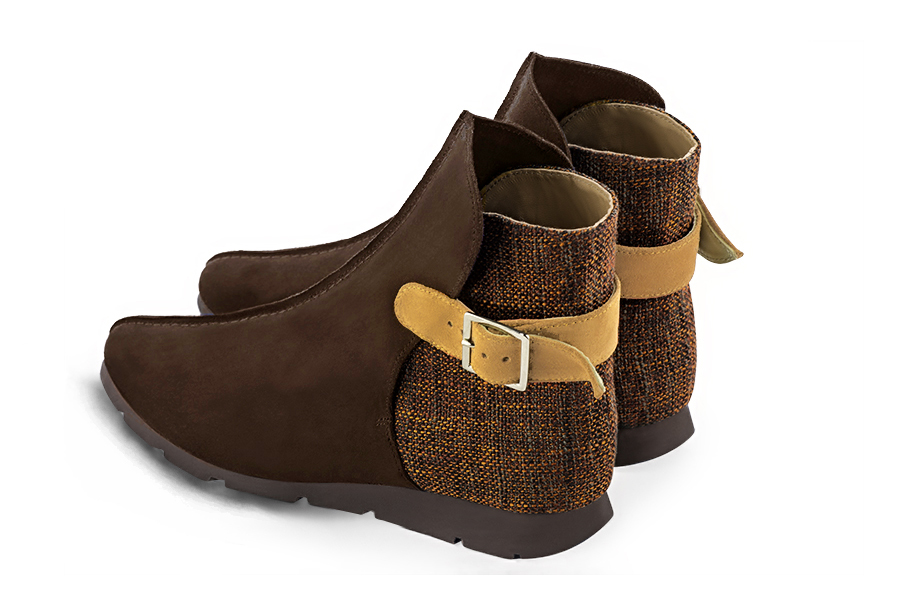 Bottines élégantes et raffinées avec des boucles à l'arrière, coloris marron ébène, orange corail et jaune ocre. Bout rond. Semelle gomme plat. Personnalisation : Choix des cuirs, des couleurs et des talons. Cou-de-pied sur mesure. - Florence KOOIJMAN