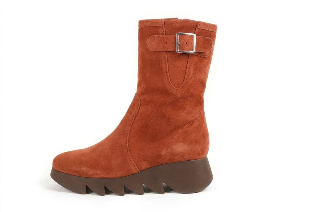 Bottines avec un zip intérieur pour femme en cuir terracotta avec bout rond et semelle épaisse et sculpturale en gomme - Vue de profil