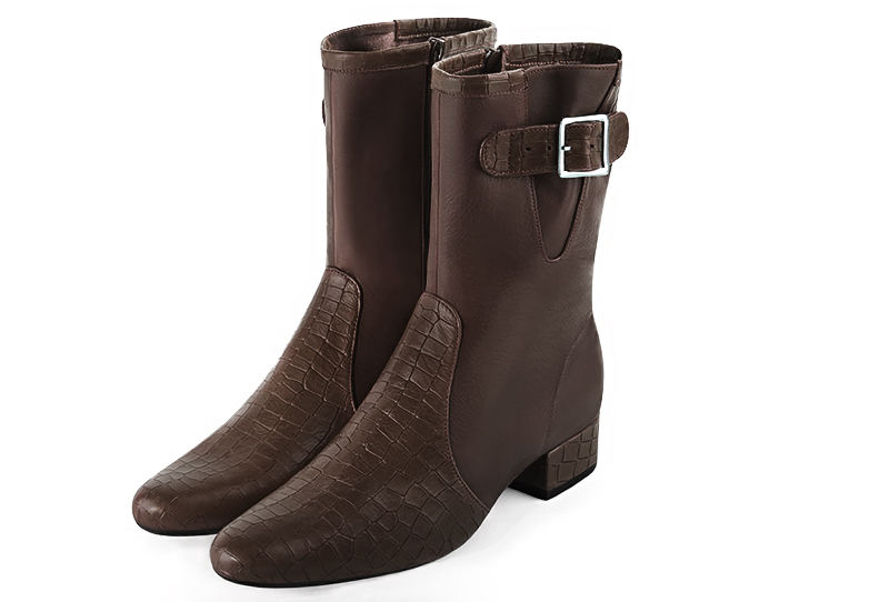 Bottines élégantes et raffinées avec des boucles sur le côté, coloris marron ébène. Bout rond. Mi-haut. Talon bottier. Personnalisation : Choix des cuirs, des couleurs et des talons. Cou-de-pied sur mesure. - Florence KOOIJMAN