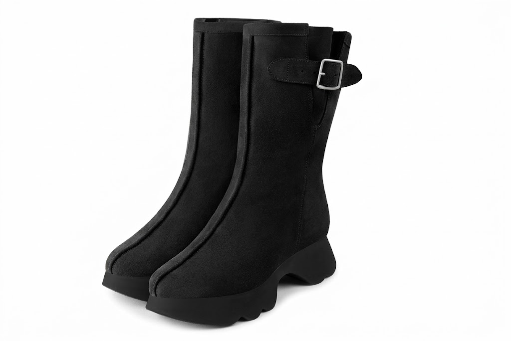 Bottines avec un zip intérieur pour femme en cuir noir mat avec bout rond et semelle épaisse et sculpturale en gomme - Vue avant