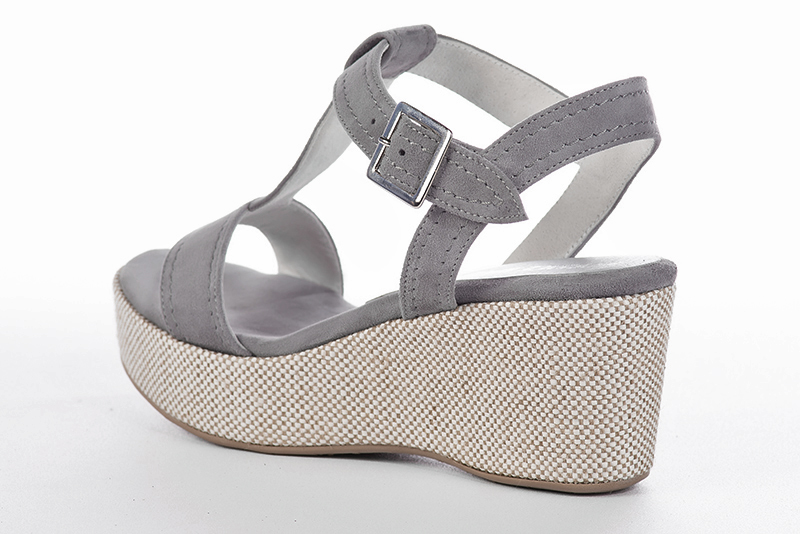 Sandales habillées complétement ouvertes, élégantes et raffinées, avec une bride sur le cou-de-pied, coloris gris galet. Bout rond. Semelle compensée talon mi-haut. Cérémonie, soirée, cocktail, évènementiel. Personnalisation : Choix des cuirs, 
                des couleurs et des talons. Petites et grandes pointures. - Florence KOOIJMAN