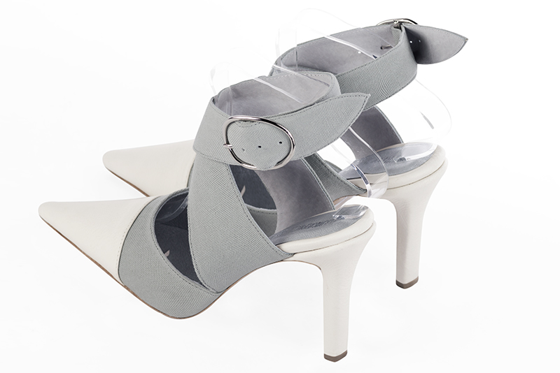Chaussures habillées, élégantes et raffinées, ouvertes à l'arrière avec des brides croisées, coloris blanc pur et gris tourterelle. Bout pointu. Très haut. Talon fin. Cérémonie, soirée, cocktail, évènementiel. Personnalisation : Choix des cuirs, 
                des couleurs et des talons. Petites et grandes pointures. - Florence KOOIJMAN