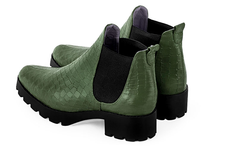 Boots femme : Boots élastiques sur les côtés couleur vert bouteille et noir mat. Bout rond. Semelle gomme petit talon. Vue de profil - Florence KOOIJMAN