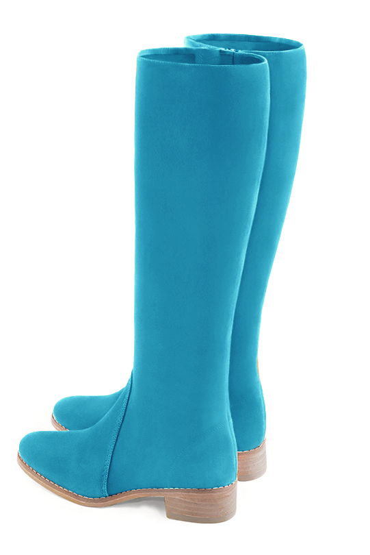 Botte femme : Bottes femme cavalières sur mesures couleur bleu turquoise. Bout rond. Semelle cuir petit talon. Vue arrière - Florence KOOIJMAN